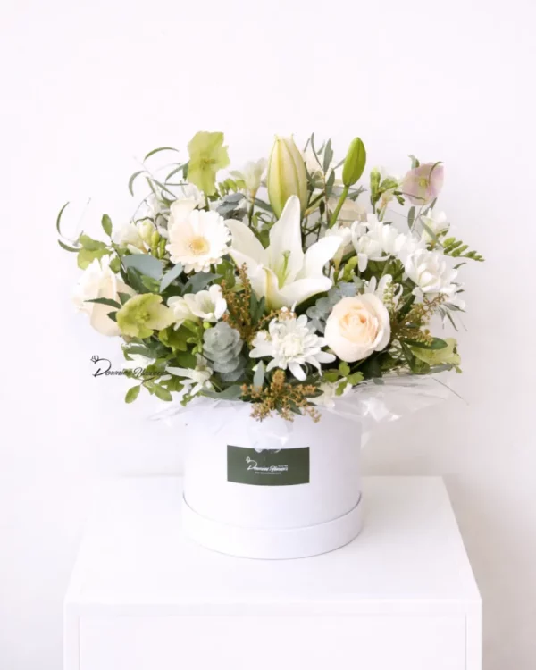 Boxed Love Garden sympathy flower arrangement, fresh in-season blooms in a hat box, Christchurch florist condolence.