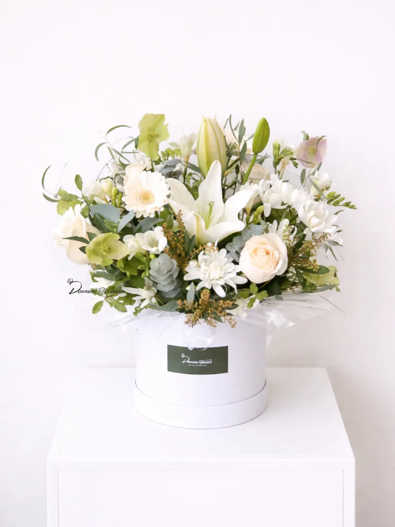 Boxed Love Garden sympathy flower arrangement, fresh in-season blooms in a hat box, Christchurch florist condolence.