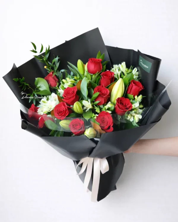 Classic Red & White bouquet – red roses with white lilies, lush greenery, modern black wrap