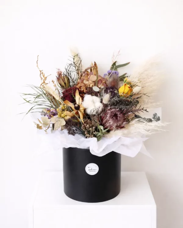 Dried flower arrangement in black hat box, natural earthy tones, everlasting gift bouquet Christchurch