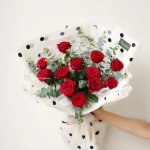 Passion n Affection — dozen red roses bouquet with foliage, elegant modern wrap