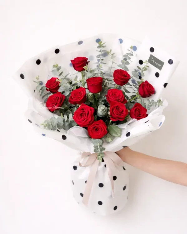Passion n Affection — dozen red roses bouquet with foliage, elegant modern wrap
