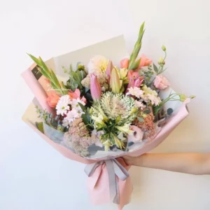 Pop wrapped bouquet with seasonal flowers in a Softness colour palette – Christchurch florist