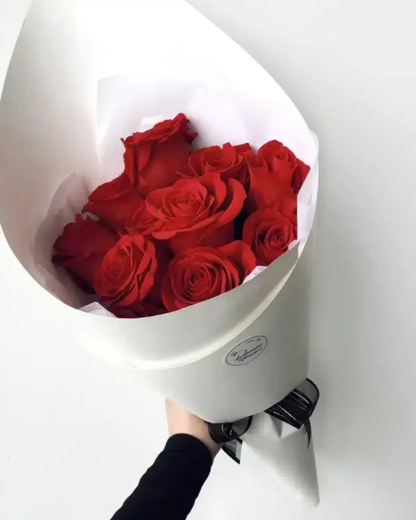 Rose Only bouquet with premium red roses — minimalist modern wrap, no fillers