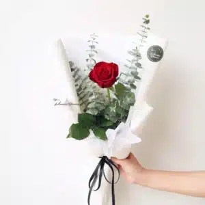 single red rose bouquet wrapped with foliage – The One, Christchurch florist