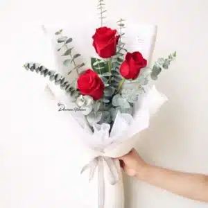 Three red roses bouquet wrapped with foliage – The Three Words, Christchurch florist