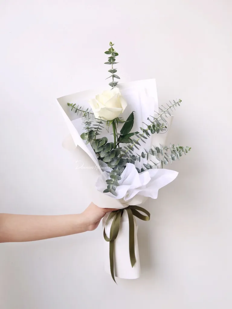 Single premium white rose, gift-wrapped with foliage, "The One" bouquet, Christchurch flower delivery.