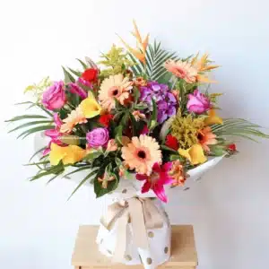 Blossom vox arrangement with bright seasonal flowers and foliage – Christchurch florist